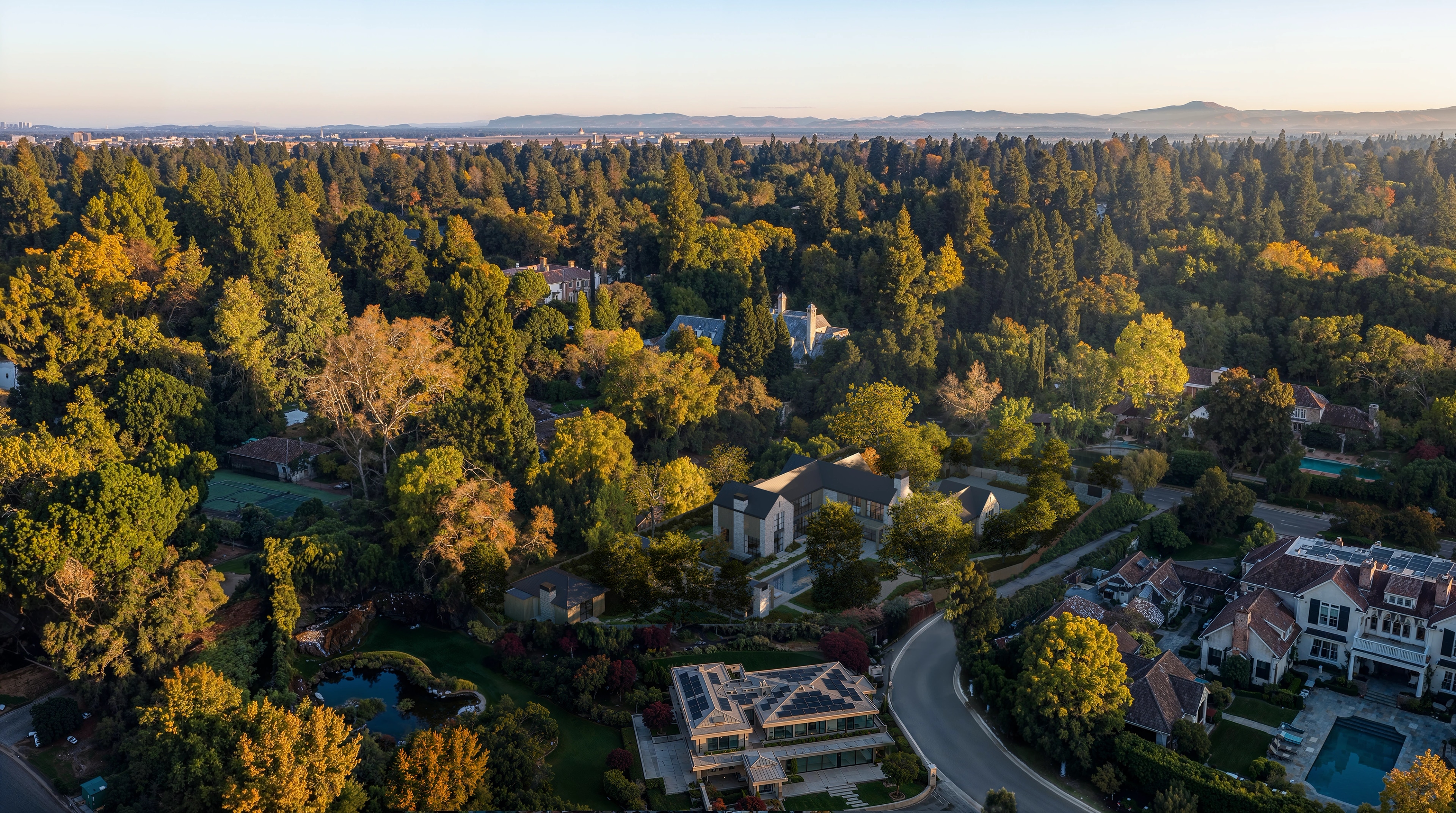 Aerial view of Elena House among oak trees in Atherton at dusk
