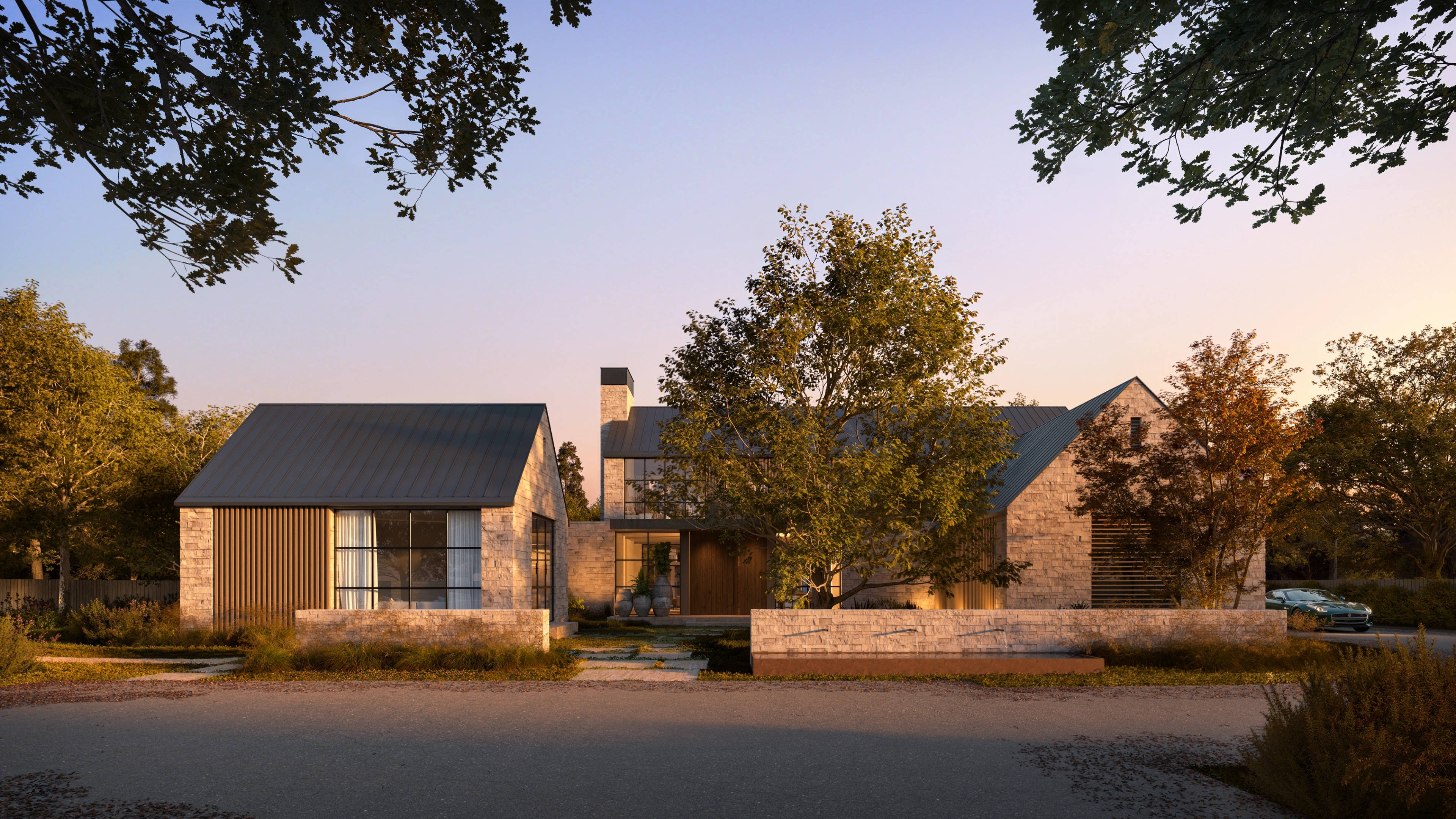 Street facade of Elena House at dusk, three stone volumes behind a low wall