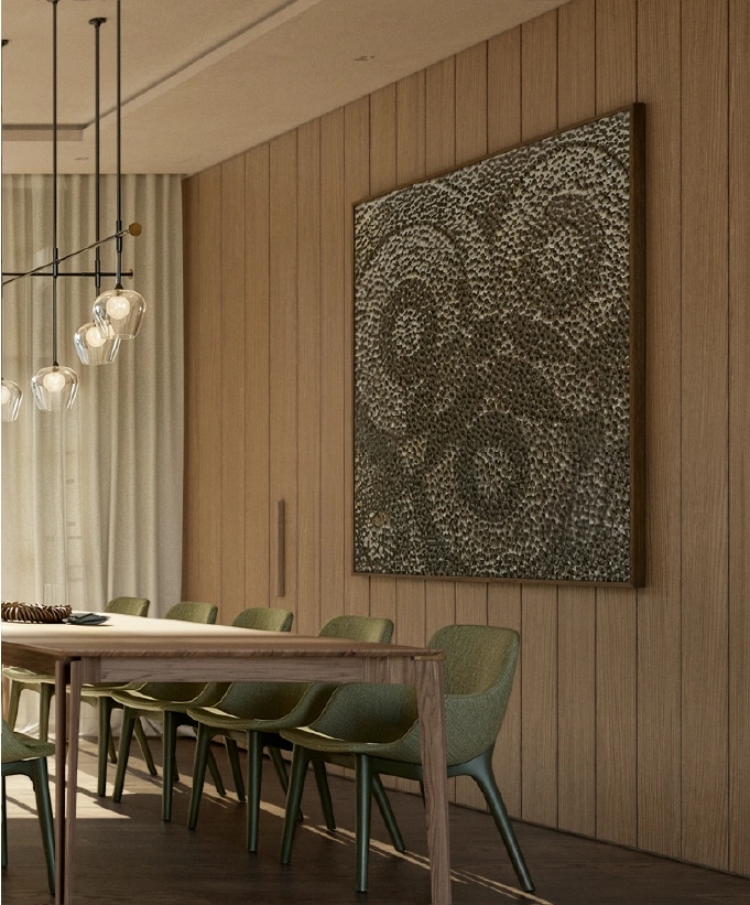 Dining table and artwork at Elena House, with green chairs and oak wall