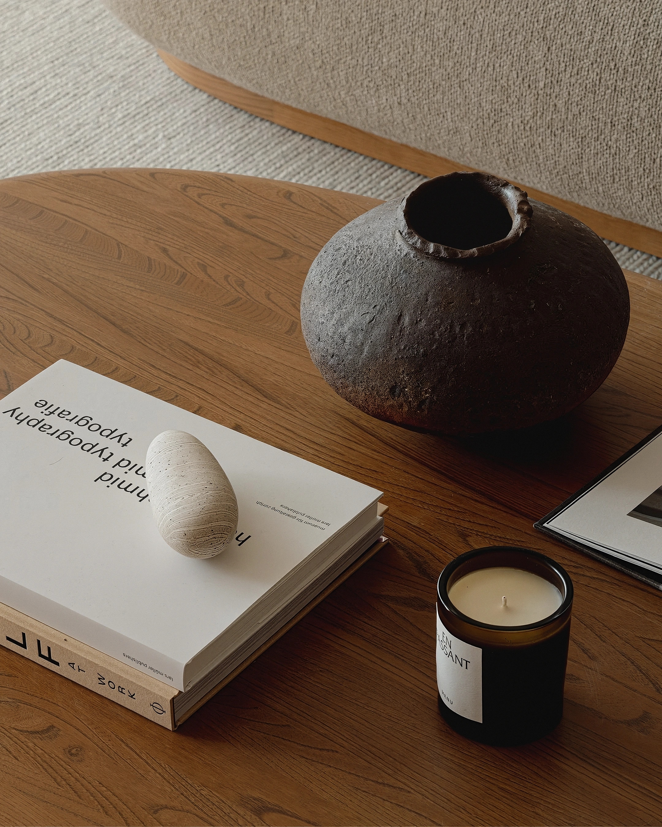 Still life with books, stone vessel and candle at Bryant House
