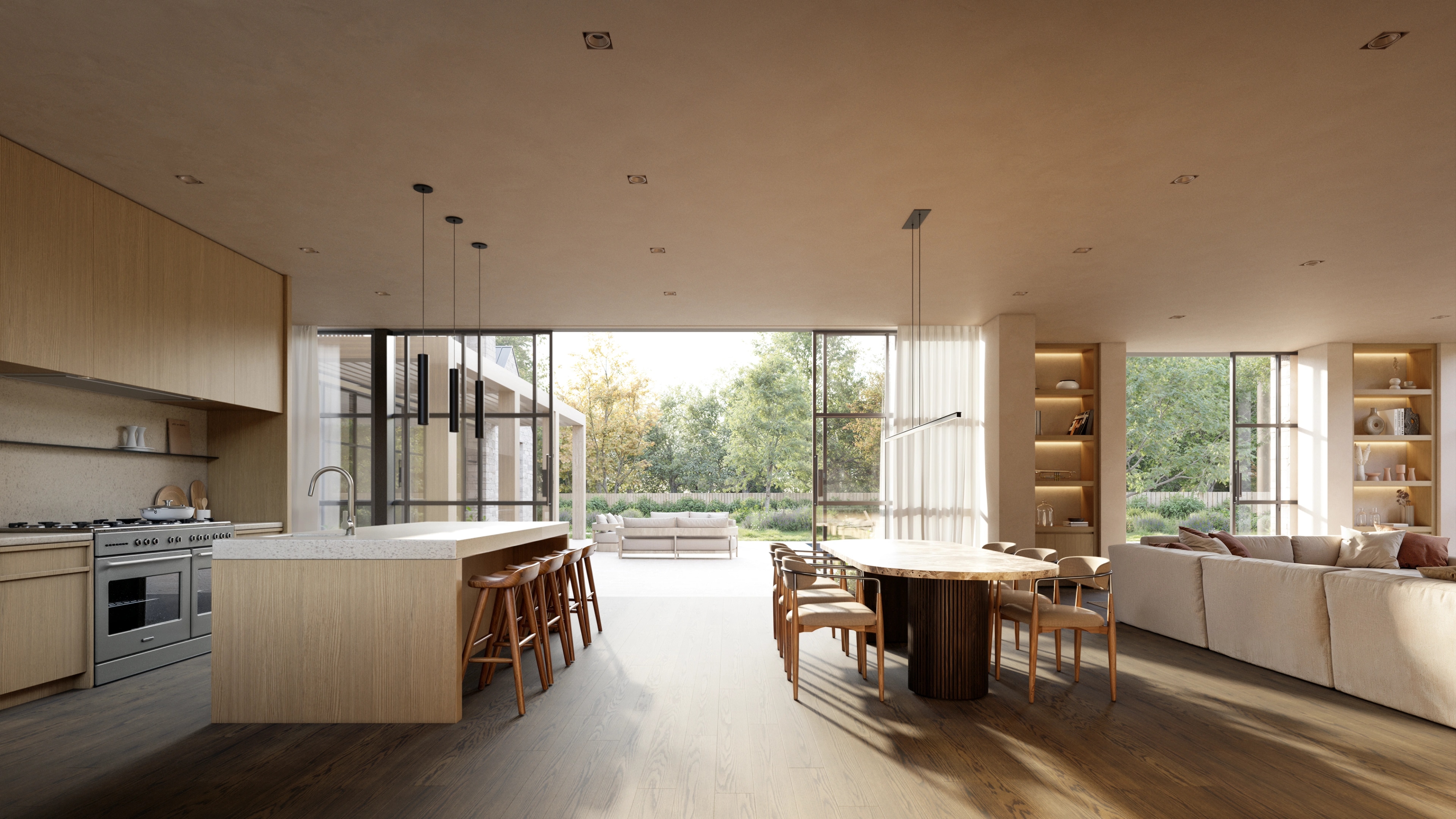 Kitchen opening onto the garden at Elena House, with oak island and pendant lights