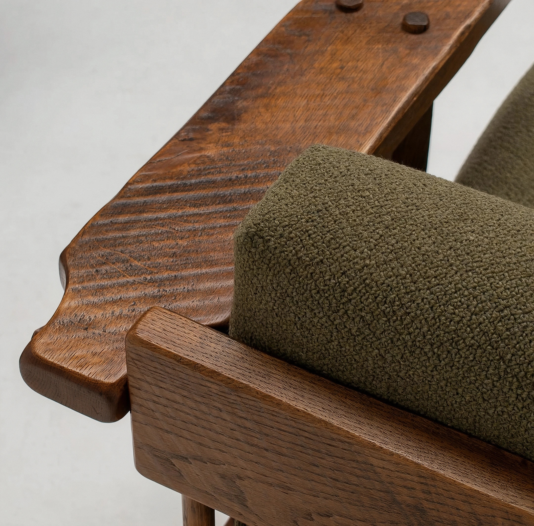 Wooden armchair with an olive cushion at Melanie House